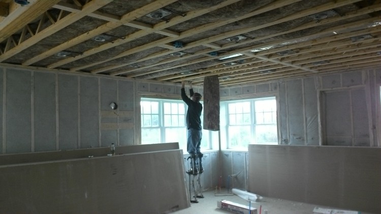 The kitchen-ceiling insulator wore stilts!