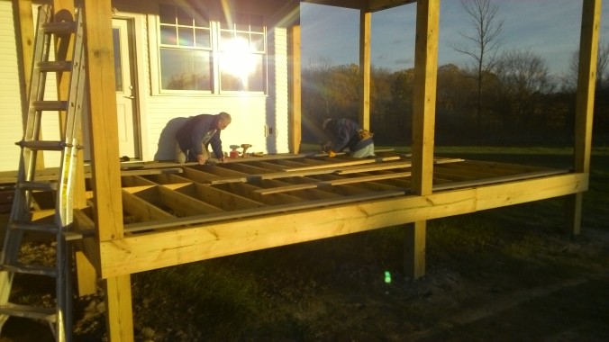 Starting to deck the front porch. At 56 feet long, each row requires three planks end to end.