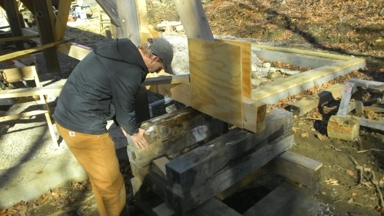 Ben builds up one cribbing tower.